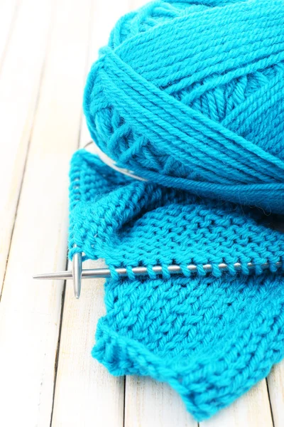 Knitting with spokes on wooden background — Stock Photo, Image