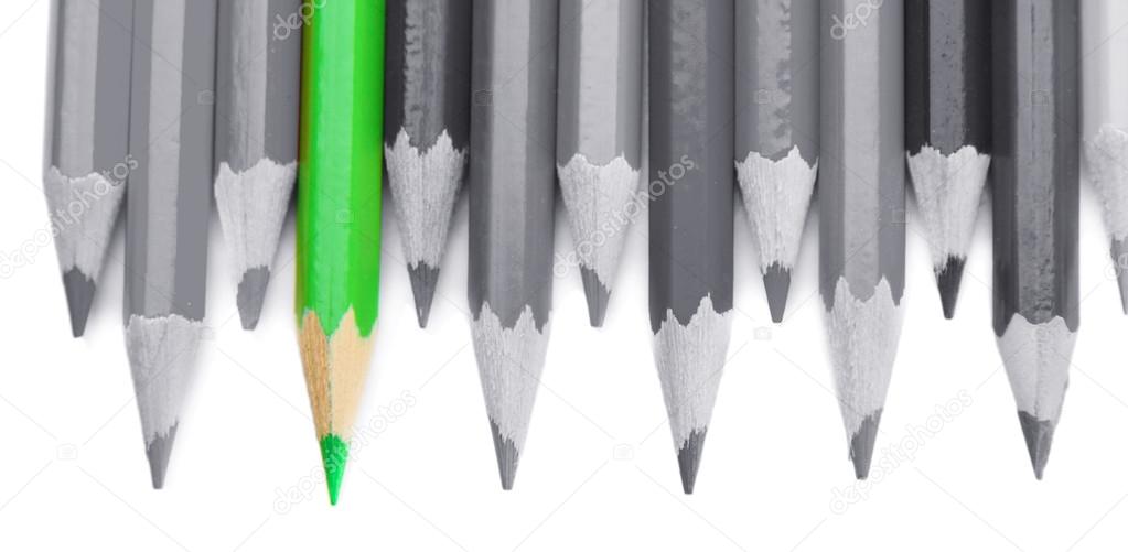 Concept of individuality.One bright color pencil among grey pencils