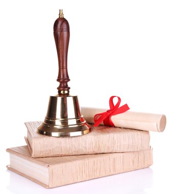 Altın retro okul zili ilerleyin ve üzerinde beyaz izole kitap