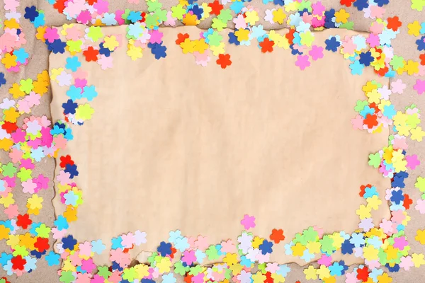 Confetti frame op oud papier — Stockfoto