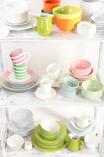 Different tableware on shelf, isolated on white — Stock Photo, Image