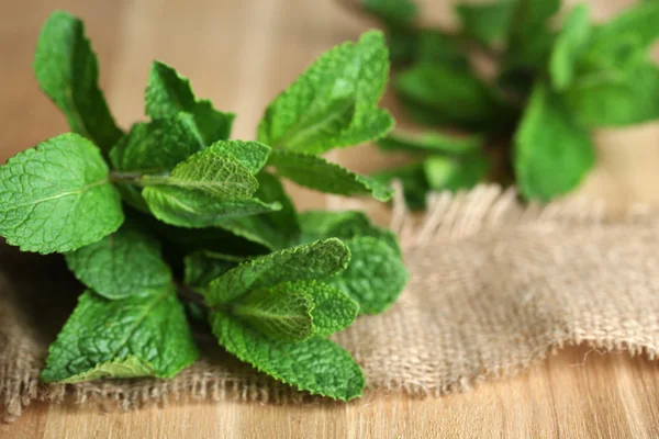 Mint on wooden background — Stock Photo, Image