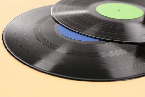 Old vinyl records on brown background — Stock Photo, Image