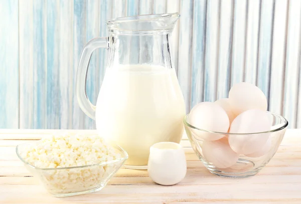 Tasty dairy products on wooden table — Stock Photo, Image