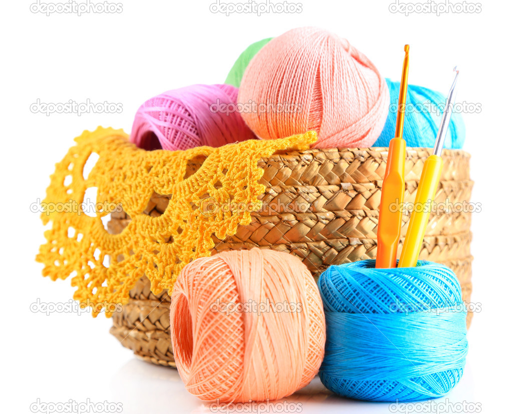 Colorful yarn for knitting with napkin in wicker basket and crochet hook, isolated on white