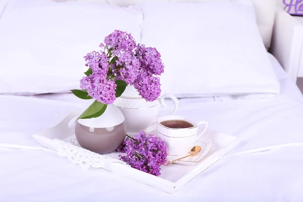 Wooden tray with light breakfast on bed — Stock Photo, Image