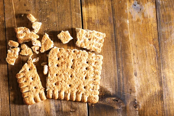 Crushed cookie on wooden background — Stock Photo, Image