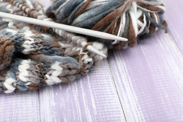 Knitting with spokes on wooden background — Stock Photo, Image