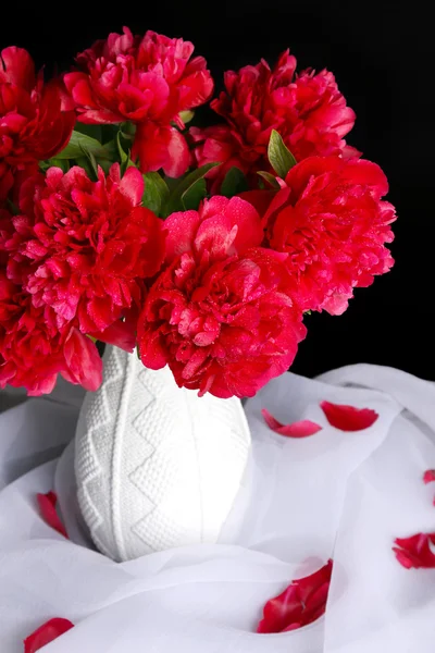 Beautiful pink peonies in vase, on dark background — Stock Photo, Image