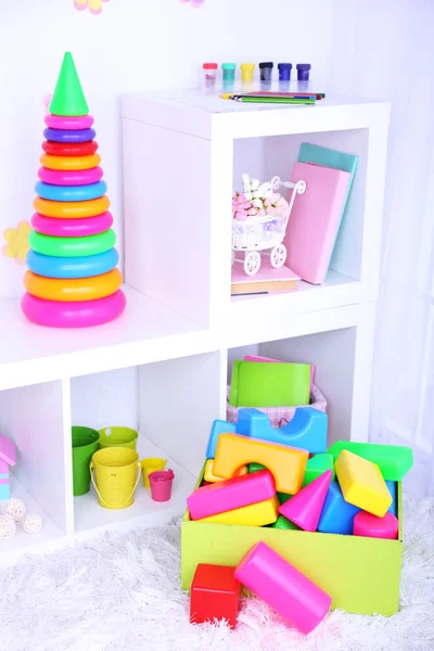 Colorful plastic toys in children room — Stock Photo, Image