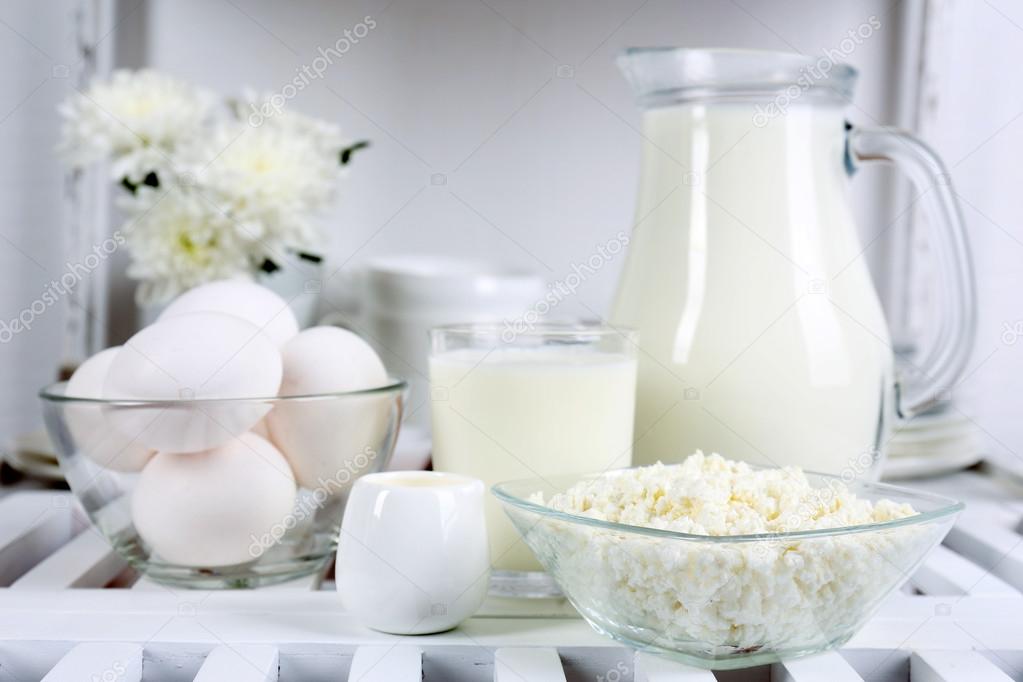 Still life with tasty dairy products on wooden table