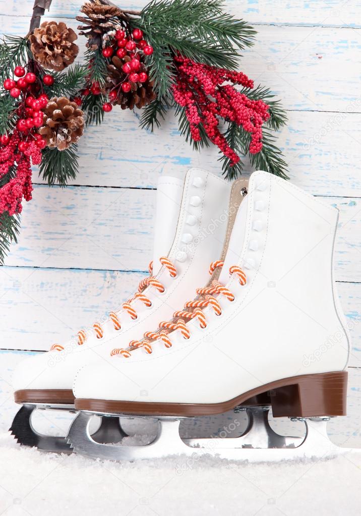 Figure skates on wooden background