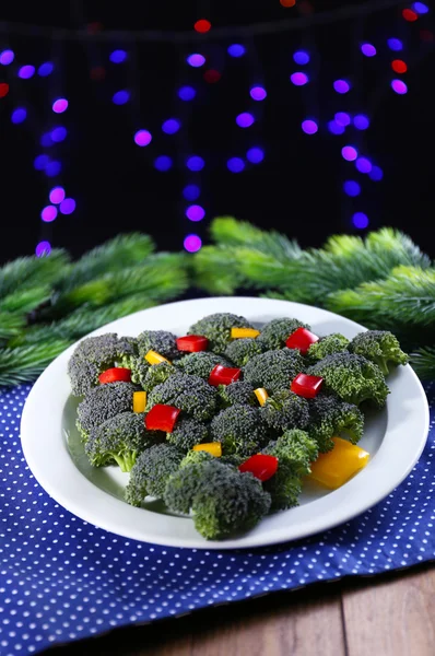 Christmas tree from broccoli on table on dark background — Stock Photo, Image