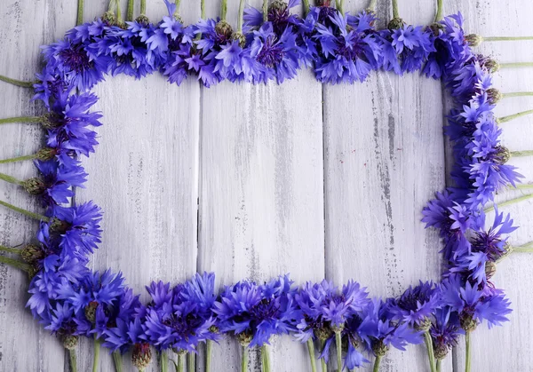 Cornflowers on wooden background — Stock Photo, Image