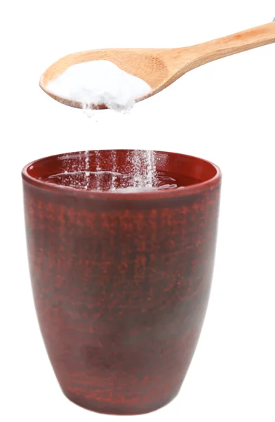 Spoon of baking soda over glass of water — Stock Photo, Image