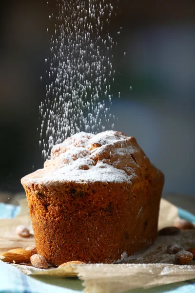 Tasty cake on table on dark background — Stock Photo, Image