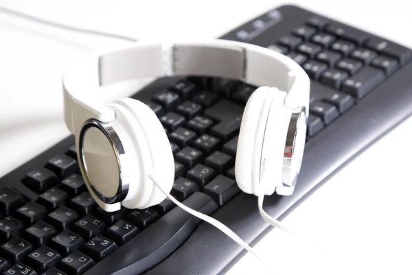 Headphone and keyboard — Stock Photo, Image