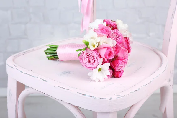 Beautiful wedding bouquet on wooden chair — Stock Photo, Image