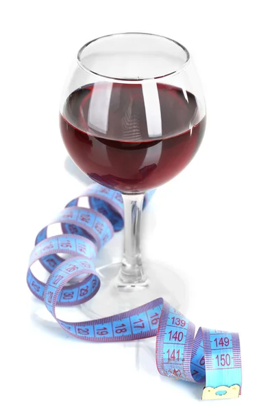 Glass of wine and measuring tape isolated on white — Stock Photo, Image