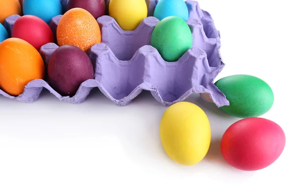 Colorful Easter eggs in tray isolated on white — Stock Photo, Image