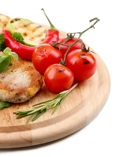 Grilled steak with spices, herbs and vegetables  on wooden board, isolated on white — Stock Photo, Image