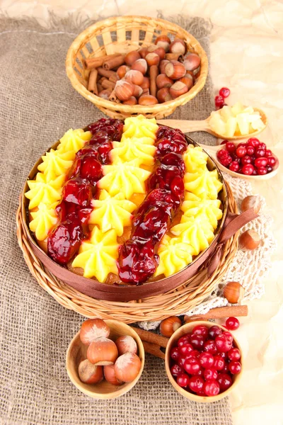 Tasty fruity homemade pie with berries and nuts, on brown background — Stock Photo, Image