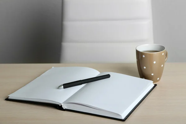 Empty workplace in office on gray background — Stock Photo, Image