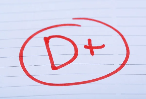 Grade D written on an exam paper — Stock Photo, Image