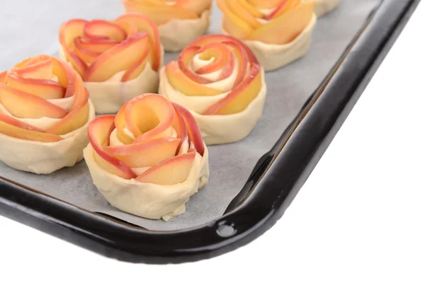 Tasty  puff pastry with apple shaped roses on pan close-up — Stock Photo, Image