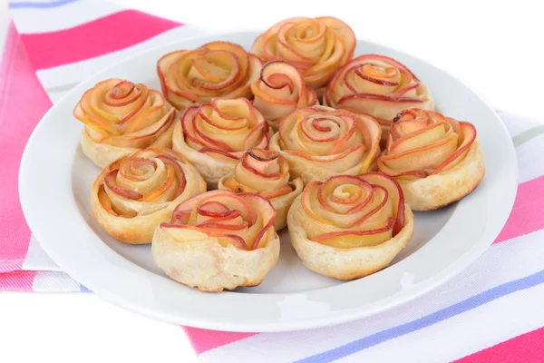 Tasty puff pastry with apple shaped roses on plate close-up — Stock Photo, Image