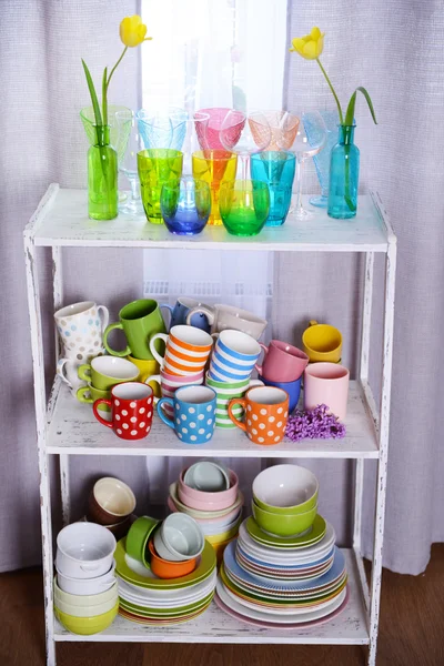 Different tableware on shelf in the interior — Stock Photo, Image