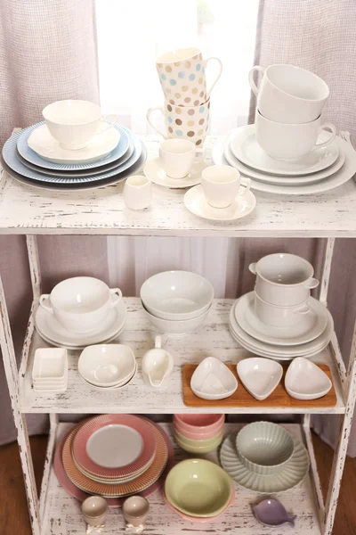 Different tableware on shelf in the interior — Stock Photo, Image