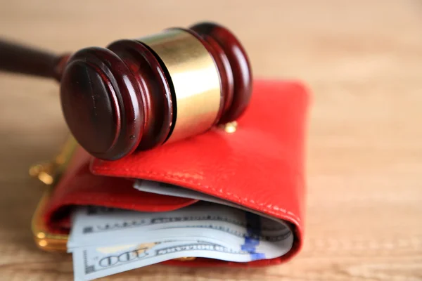 Gavel and money in wallet on wooden background — Stock Photo, Image