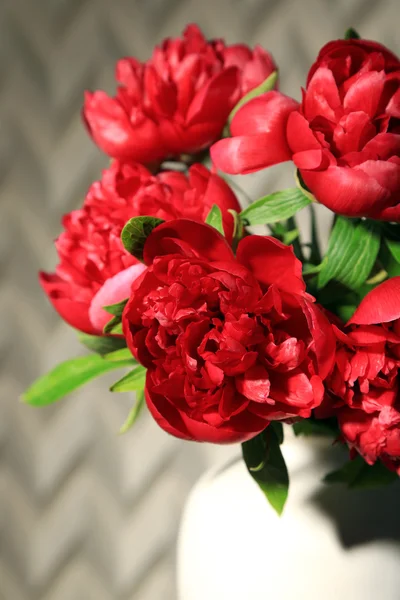 Beautiful pink peonies in vase on light background — Stock Photo, Image