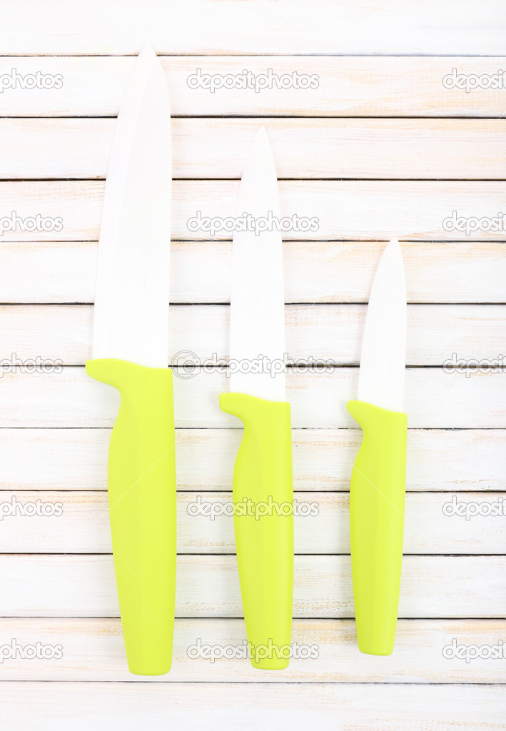 Kitchen knives on wooden table