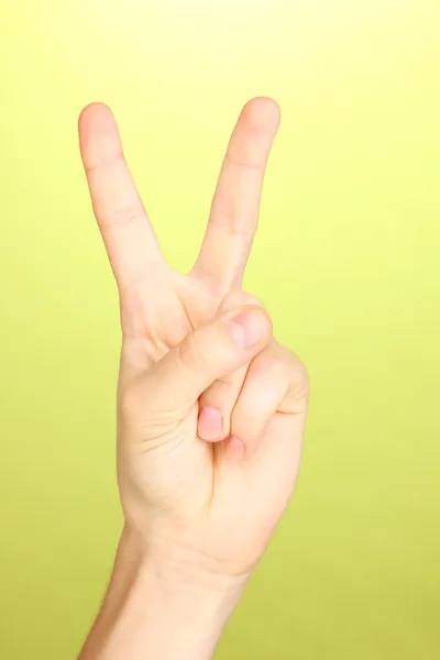 Hand making sign on green background — Stock Photo, Image