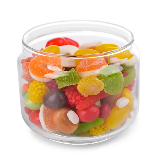Farklı renkli meyve şekeri üzerine beyaz izole kavanoz içinde — Stok fotoğraf