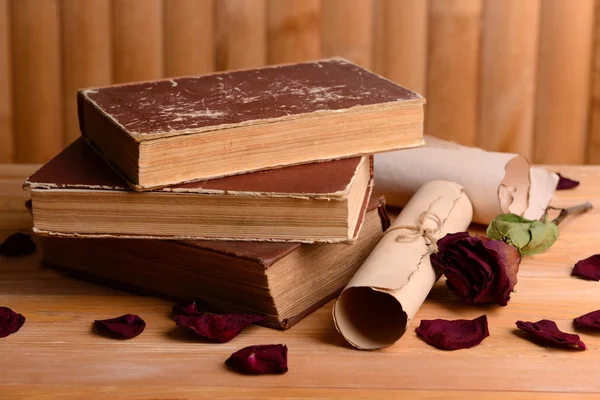 Old books on table on wooden background — Stock Photo, Image