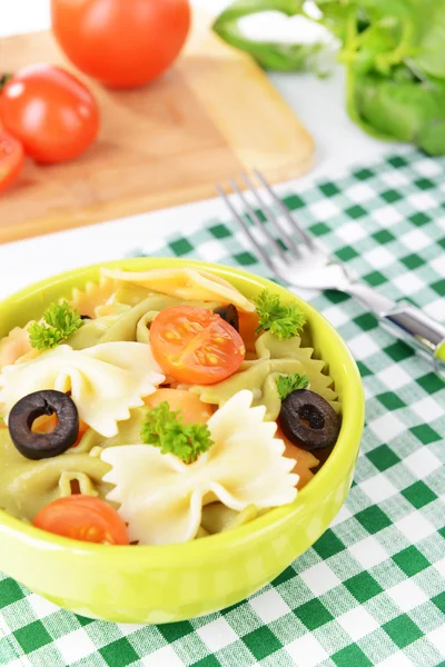 Delicious pasta with tomatoes on plate on table close-up — Stock Photo, Image