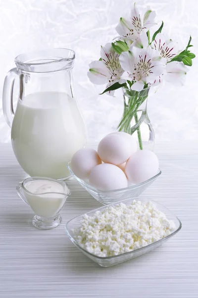 Tasty dairy products on wooden table — Stock Photo, Image