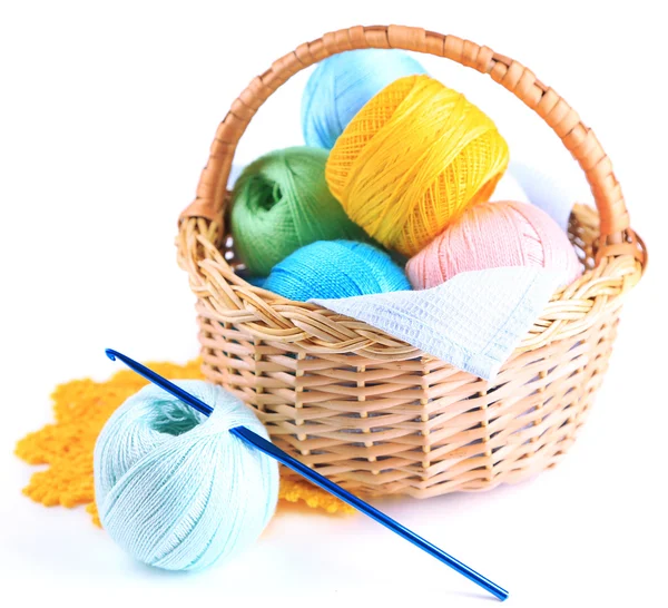 Colorful yarn for knitting with napkin in wicker basket and crochet hook, isolated on white — Stock Photo, Image