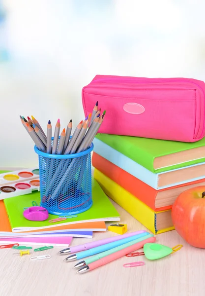 Bright school supplies on table on light background — Stock Photo, Image