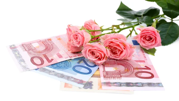 Hermosas rosas y dinero, aislado en blanco —  Fotos de Stock