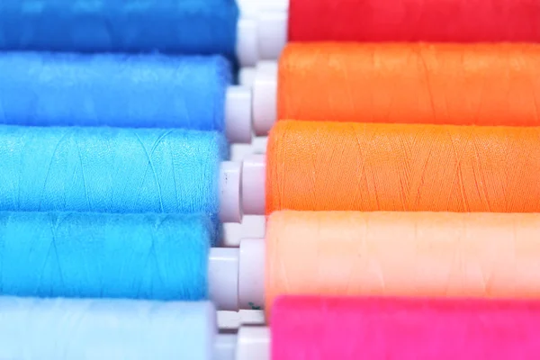 Multicolor sewing threads background — Stock Photo, Image