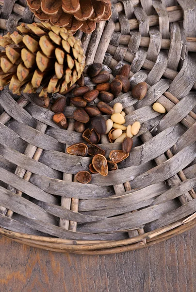 Cedar pine nuts on wooden table — Stock Photo, Image