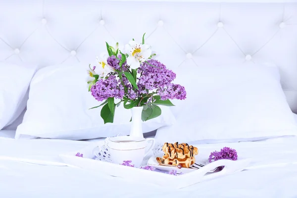 Wooden tray with light breakfast on bed — Stock Photo, Image