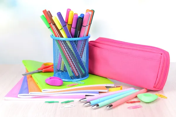 Bright school supplies on table on light background — Stock Photo, Image
