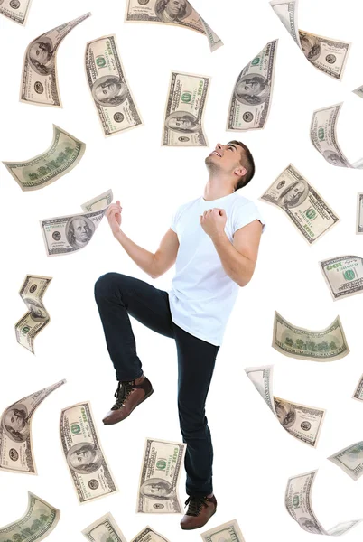 Hombre feliz disfrutando de la lluvia de dinero, aislado en blanco — Foto de Stock