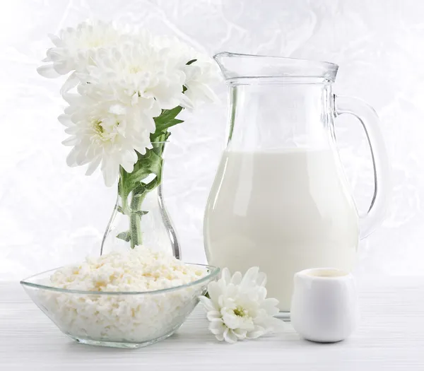 Tasty dairy products on wooden table — Stock Photo, Image