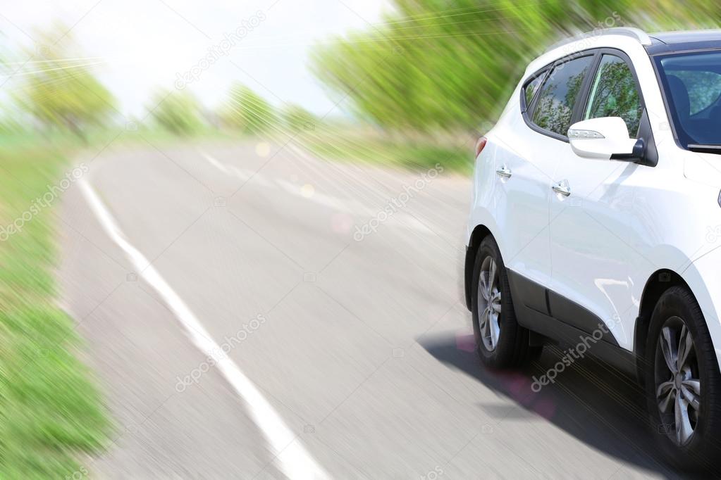 Very fast driving car on road